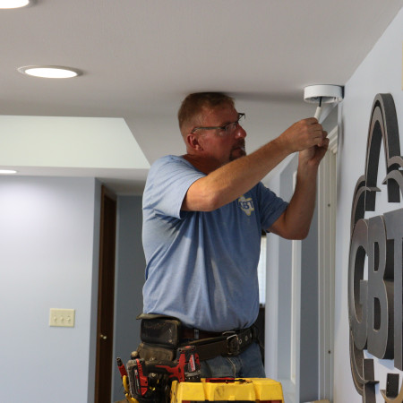 GBT tech installing security camera.